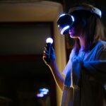 Woman enjoying virtual reality gaming at home with VR headset and controller.