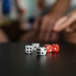 Close-up view of colorful dice on a table, capturing the essence of luck and chance.